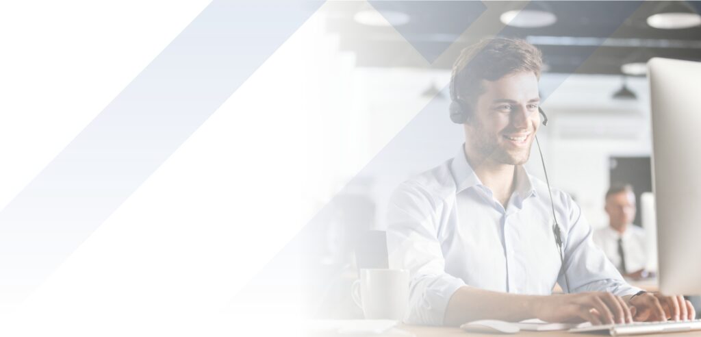 Agent wearing headset and using computer working